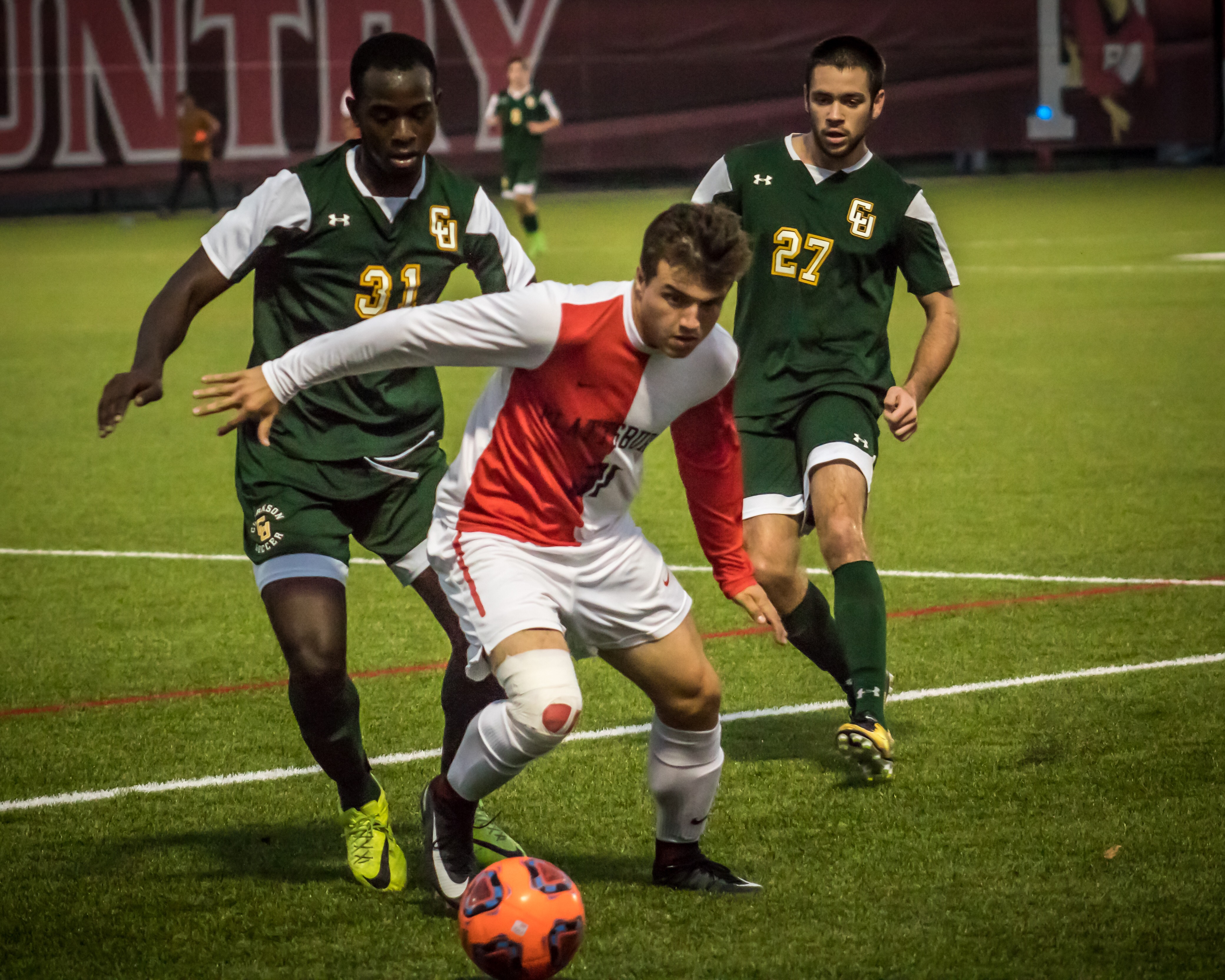 Junior forward Chris Robertson carries the ball through the Clarkson defence during their game last Saturday. The Cards went on to defeat the Golden Knights 2-0